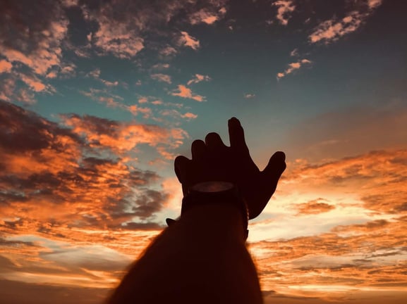 Hands Reaching Out to the Sky